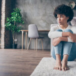 teenage-girl-sitting-sad